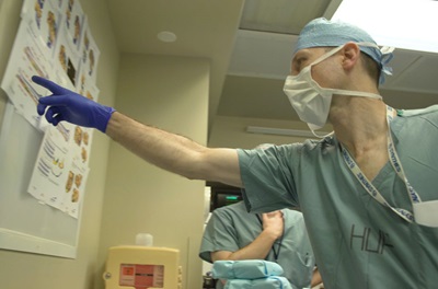 Dr. Kovach looking at chart